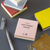 TAKEO PAPER MOTTAINAI MEMO Assorted 27 square pad featuring yellow and dark brown geometric TS Gift-7 and white coarse-striped Arajima sheets. / Bloc-notes carré TAKEO PAPER MOTTAINAI MEMO Assortiment 27 présentant des feuilles TS Gift-7 géométriques jaune et brun foncé ainsi que Arajima blanc à rayures rugueuses.