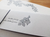 OEDA LETTERPRESS Wild Berry letter set featuring white A5 stationery with gray botanical prints, gray envelopes, and a gift tag. / Ensemble de correspondance OEDA LETTERPRESS Wild Berry avec papier A5 blanc à motifs botaniques gris, enveloppes grises et étiquette cadeau.