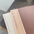 OEDA LETTERPRESS Mini Two-Colour Paper Notebook with rustic board cover options and alternating white and natural blank pages. / Mini carnet de notes bicolore OEDA LETTERPRESS avec choix de couvertures en carton rustique et pages vierges alternées blanc et naturel.