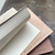 OEDA LETTERPRESS Mini Two-Colour Paper Notebook with rustic board cover options and alternating white and natural blank pages. / Mini carnet de notes bicolore OEDA LETTERPRESS avec choix de couvertures en carton rustique et pages vierges alternées blanc et naturel.