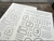 OEDA LETTERPRESS Sticker Sheet Letter in Bronze and Black displaying press-printed numbers and alphabets on heavy adhesive paper. / Feuille d'autocollants OEDA LETTERPRESS Letter en Bronze et Noir présentant des lettres et chiffres imprimés en typographie sur papier adhésif épais.
