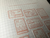 OEDA LETTERPRESS Sticker Sheet Stamp Limited Edition Botanical Pink displaying press-printed postage stamp frame designs on heavy adhesive paper. / Feuille d'autocollants OEDA LETTERPRESS Stamp Édition Limitée Rose Botanique présentant des motifs de timbres-poste imprimés en typographie sur papier adhésif épais.