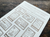 OEDA LETTERPRESS Sticker Sheet Stamp in Bronze showing press-printed numbered stamp designs 1 to 12 on heavy adhesive paper. / Feuille d'autocollants OEDA LETTERPRESS Stamp en Bronze présentant des motifs de timbres numérotés de 1 à 12 imprimés en typographie sur papier adhésif épais.