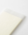 MD Notebook Diary 2027 A6 featuring minimal monthly grid spreads and cream fountain-pen-friendly MD paper. / Agenda MD Notebook Diary 2027 A6 présentant des aperçus mensuels minimalistes et du papier crème MD compatible avec les stylos-plumes.