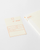 MD Notebook Diary 2027 A6 featuring minimal monthly grid spreads and cream fountain-pen-friendly MD paper. / Agenda MD Notebook Diary 2027 A6 présentant des aperçus mensuels minimalistes et du papier crème MD compatible avec les stylos-plumes.