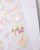 dodolulu Matte Sticker Sheet Little Something featuring a charming assortment of everyday treasures and tiny objects. / Planche d'autocollants mats dodolulu Little Something présentant un assortiment charmant de trésors du quotidien et de petits objets.