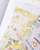 dodolulu Matte Sticker Sheet An Afternoon featuring cozy slow living illustrations like sunlit reading, tea, and quiet relaxation. / Planche d'autocollants mats dodolulu An Afternoon présentant des illustrations douces de la vie lente, de la lecture au soleil, du thé et de la détente.