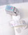dodolulu Label Sticker Roll Reverie made of textured washi paper with shimmering foil stamping featuring 8 repeating designs. / Rouleau d'étiquettes autocollantes dodolulu Reverie en papier washi texturé avec dorure étincelante présentant 8 motifs répétés.