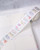 dodolulu Label Sticker Roll Reverie made of textured washi paper with shimmering foil stamping featuring 8 repeating designs. / Rouleau d'étiquettes autocollantes dodolulu Reverie en papier washi texturé avec dorure étincelante présentant 8 motifs répétés.