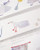 dodolulu doremi Washi Tape Miles Away featuring pre-cut watercolor illustrations of whimsical travel and daydream motifs. / Ruban washi pré-découpé dodolulu doremi Miles Away présentant des illustrations à l'aquarelle de voyage et de rêverie.