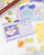 dodolulu 2027 Monthly Calendar Stickers set featuring 12 die-cut calendar cards and 15 decorative stickers with a subtle sand glitter finish in a keepsake box. / Ensemble d'autocollants calendrier mensuel 2027 dodolulu comprenant 12 cartes de calendrier découpées et 15 autocollants décoratifs avec une finition pailletée sablée dans une boîte souvenir.