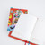 Hobonichi A6 Pencil Board Yumi Kitagishi: In the Room. Thin Yupo board for A6 with two cats in a colourful room, millimetre ruler and Today tab. Planche à crayon Hobonichi A6 Yumi Kitagishi : In the Room. Plaque Yupo fine pour A6 : deux chats dans une pièce colorée, règle millimétrée et onglet Today.
