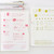 Hobonichi x TSUKI no IRO Uniball One 0.38 Jan–June Set with Case. Six 0.38 mm pens in monthly colours from Mandarin Orange to Green Black, in a brown PVC case with a rear pocket. Set Uniball One 0.38 Hobonichi x TSUKI no IRO janv.–juin avec étui. Six stylos 0,38 mm aux couleurs mensuelles, de Mandarin Orange à Green Black, dans un étui PVC brun à poche arrière.
