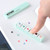 Hobonichi x Kodomo no Kao Pochitto6 Push-Button Stamp Moomin. Slim self-inking stamp stick with six small 5.5 mm Moomin icons in different colours. Tampon poussoir Pochitto6 Hobonichi x Kodomo no Kao Moomin. Bâtonnet tampon auto-encreur avec six petites icônes Moomin de 5,5 mm en couleurs différentes.