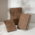 TAKE A NOTE Planner PU Cover B6 Kurumi. Soft water-repellent PU cover in warm wood-tone Kurumi for B6 planners, with a card slot and rounded edges. Couverture PU TAKE A NOTE Planner B6 Kurumi. Couverture souple hydrofuge en PU ton bois chaud Kurumi pour agendas B6, avec fente pour cartes et bords arrondis.