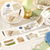 BGM Life Washi Tape Collage Piece (1.5 cm). A 15 mm × 5 m foil-stamped washi roll of antique collage fragments. Ruban washi BGM Life Collage Piece (1,5 cm). Rouleau washi 15 mm × 5 m, fragments de collage ancien et dorure.