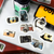 BGM IPPAI Sticker Set Lots of Cameras. A foil-stamped flake pack of 45 camera stickers (15 designs × 3) in a 90 × 100 mm sleeve. Set d’autocollants BGM IPPAI Lots of Cameras. 45 stickers appareils photo dorés (15 motifs × 3), pochette 90 × 100 mm.