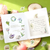 BGM Petit Story Sticker Set Garden. A foil-stamped flake pack of 45 gardening stickers (15 designs × 3) in a 90 × 100 mm sleeve. Set d’autocollants BGM Petit Story Garden. 45 stickers jardinage dorés (15 motifs × 3), pochette 90 × 100 mm.