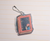 La Dolce Vita Acrylic Keychain Journal with Me mirror acrylic charm. / Porte-clés en acrylique miroir La Dolce Vita Journal with Me.
