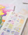 dodolulu 2027 Monthly Planner Stickers set including monthly calendar stickers and index tabs printed on premium woodfree paper. / Ensemble d'autocollants pour agenda mensuel 2027 dodolulu comprenant des autocollants de calendrier mensuel et des onglets d'index sur papier sans bois de qualité supérieure.