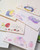 dodolulu 2027 Monthly Planner Stickers set including monthly calendar stickers and index tabs printed on premium woodfree paper. / Ensemble d'autocollants pour agenda mensuel 2027 dodolulu comprenant des autocollants de calendrier mensuel et des onglets d'index sur papier sans bois de qualité supérieure.