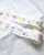 dodolulu 2027 365 Daily Washi Tape Calendar set featuring two rolls of perforated daily washi tape stickers with release paper backing. / Ensemble de rubans washi calendrier 2027 365 jours dodolulu comprenant deux rouleaux d'autocollants perforés quotidiens sur papier protecteur.