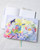 dodolulu 2027 Weekly and Monthly Planner B6 with soft PU cover and full-color illustrated interior pages. / Agenda hebdomadaire et mensuel 2027 B6 dodolulu avec couverture souple en PU et pages intérieures illustrées en couleurs.