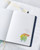 dodolulu 2027 Weekly and Monthly Planner B6 with soft PU cover and full-color illustrated interior pages. / Agenda hebdomadaire et mensuel 2027 B6 dodolulu avec couverture souple en PU et pages intérieures illustrées en couleurs.