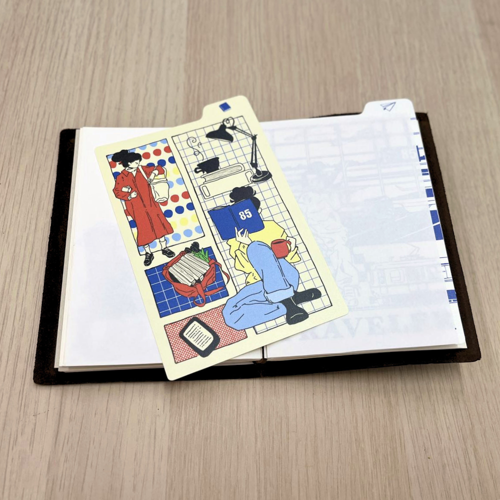 85 Rue Tranquille x thanh.illustrates Gumpy Girl Writing Mat - Book Edition (TN Passport Size)