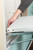 Iron-A-Way Ironing Center - 42 Inch Built In Swiveling Ironing Board With Electric System, Light and Toggle Switch - Right Hinged Raised White Dooor - AE42RWU