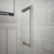 DreamLine Unidoor 52-53 in. W x 72 in. H Frameless Hinged Shower Door with Shelves in Oil Rubbed Bronze