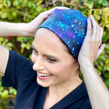 Woman placing hands on her head while wearing Super Tie - Space Dust