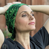 Nurse taking a moment with hands behind her head wearing Super Tie - Pot Head