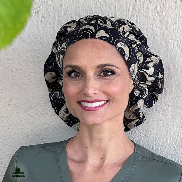 Front view of nurse wearing Green Scrubs Bouffant Hat - Hibiscus Coconut