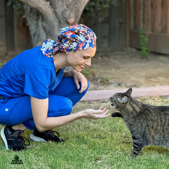 Woman greeting cat while wearing Green Scrubs - Tie Bonnet Hat - Alley Cats