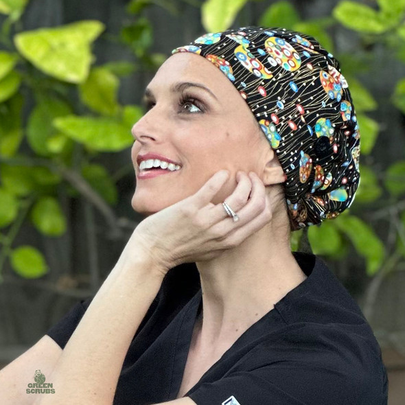 Nurse taking a moment resting head on hand while wearing Super Tie - Luminaire