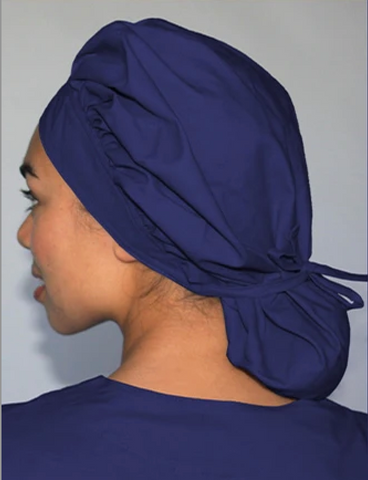 medical professional wearing a tie bonnet scrub hat