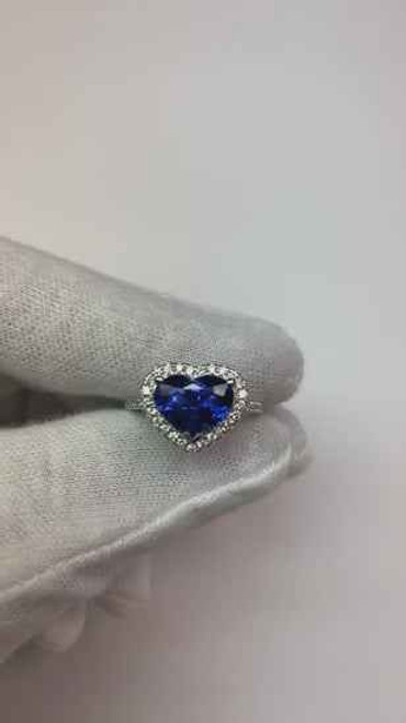 halo heart sapphire ring, Ceylon sapphire engagement ring, 3 carat heart cut sapphire, AAA quality sapphire ring, natural blue sapphire jewelry, luxury gemstone engagement ring, bespoke sapphire diamond ring, fine sapphire and diamond jewelry, VS1 diamond halo ring, F color diamond accents, 14K white gold sapphire ring, high jewelry sapphire collection, collector's sapphire engagement ring, investment grade sapphire jewelry, certified sapphire and diamond ring, elegant heart cut sapphire ring, sophisticated gemstone engagement ring, prestigious fine jewelry, exclusive sapphire diamond ring
