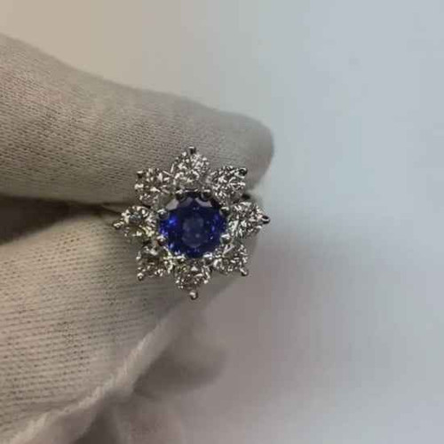 luxury sapphire halo ring, AAA blue sapphire jewelry, round cut sapphire and diamond ring, 4.50 carat gemstone ring, VS1 diamond halo ring, F color diamond fine jewelry, natural earth-mined sapphire, bespoke white gold ring, 14K white gold gemstone ring, investment-grade sapphire jewelry, collector’s sapphire and diamond ring, prestigious floral style ring, high jewelry statement piece, certified sapphire diamond ring, sophisticated gemstone engagement ring