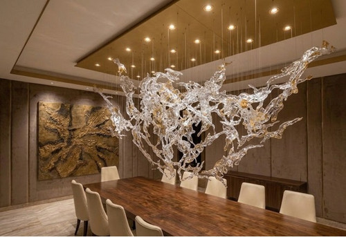 luxury chandelier, floating glass sculpture, sculptural lighting installation, architectural lighting, contemporary art lighting, high-end interior design, modern luxury aesthetic, glass and gold chandelier, ethereal lighting design, suspended glass forms, fluid motion design
