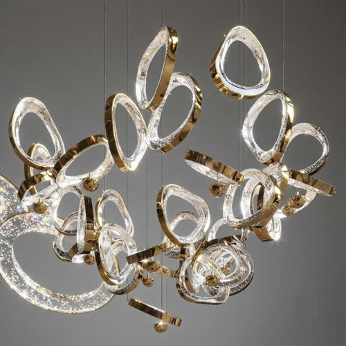 chandelier, modern chandelier, luxury chandelier, designer chandelier, contemporary chandelier, custom chandelier, bespoke chandelier, cascading chandelier, floating glass chandelier, floating glass, glass chandelier, crystal chandelier, gold chandelier, gold-trimmed chandelier, luxury lighting, modern lighting, contemporary lighting, designer lighting, bespoke lighting, architectural lighting, statement lighting, grand chandelier, high-end chandelier,