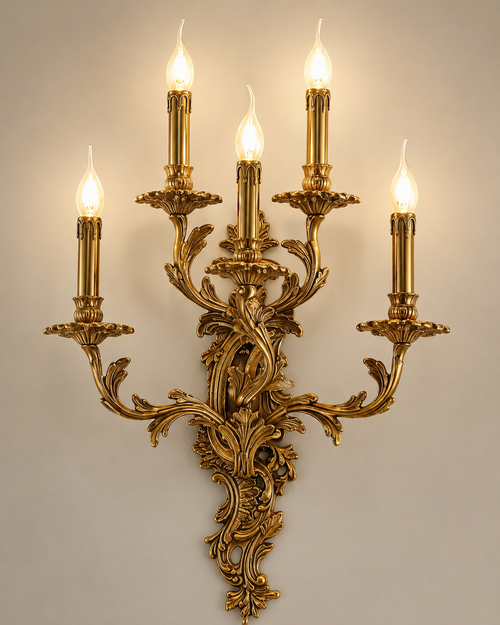 Amélie French Rococo Brass Wall Light – Ornate 5 Arm Candle Sconce
Close-up product view of the Amélie French Rococo brass wall light, featuring five candle-style lights, elaborate acanthus leaf detailing and a richly sculpted antique brass finish. A grand Louis XV-inspired wall sconce ideal for château interiors, period homes, luxury hotels, formal living rooms and traditional entrance halls.