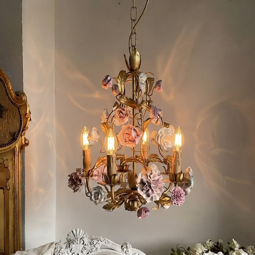 Felicity chandelier, whimsical chandelier, Bridgerton-inspired lighting, fairycore decor, cottagecore light fixture, floral chandelier, porcelain flower light, romantic home decor, vintage pastel lighting, statement ceiling light, shabby chic chandelier, romantic interior design, aesthetic room decor, fairytale lighting, antique gold chandelier, ceramic flower light, pastel aesthetic, vintage home accents, fairytale bedroom decor, whimsical lighting, cottagecore aesthetic, fairycore aesthetic, Bridgerton decor