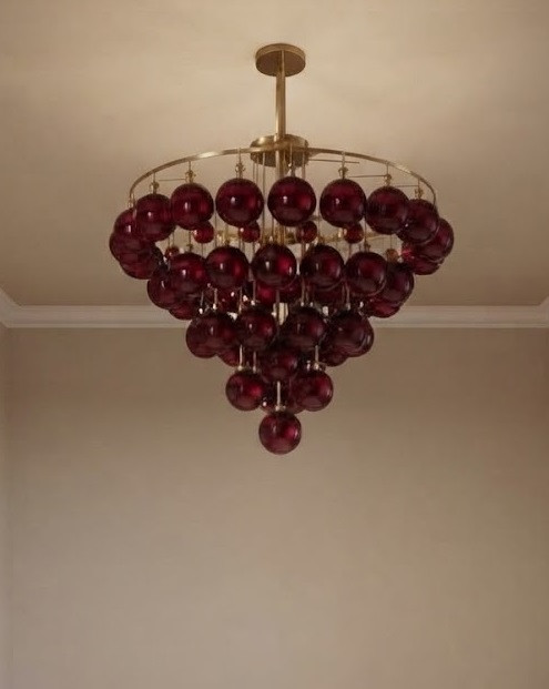 Thion chandelier, burgundy glass chandelier, tiered brass light fixture, luxury Italian style lighting, 80cm statement chandelier, designer ruby glass ceiling light, high-end dining room lighting, gold and burgundy decor, modern luxury ceiling fixture, elegant interior lighting, premium brass chandelier, deep red glass pendant, contemporary Italian lighting, luxury home decor, sophisticated dining light, grand foyer chandelier, artisan glass lighting, upscale living room light, interior design centerpiece, bespoke lighting fixture, brushed brass ceiling light, wine-colored glass chandelier, luxury kitchen chandelier