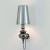 A silver Metalarte Josephine Mini Wall Lamp Sconce exudes elegance and refinement with its sleek silver finish. The silver color adds a touch of sophistication and versatility to the overall design, making it a timeless choice that can seamlessly blend with various interior styles.

The wall lamp sconce features a metal frame with a smooth silver coating, lending a sleek and contemporary look. The silver finish is applied meticulously, resulting in a polished and reflective surface that enhances the visual appeal of the fixture. The silver frame adds a touch of glamour and modernity to any space.

The lampshade of the silver Metalarte Josephine Mini Wall Lamp Sconce is typically made of fabric, complementing the silver frame beautifully. The fabric shade softens and diffuses the light, creating a warm and inviting ambiance. It casts a gentle glow that adds a touch of coziness and elegance to the room.

Like other versions of the Josephine Mini Wall Lamp Sconce, the silver variant retains the adjustable arm feature. This allows you to easily adjust the lamp's angle and direct the light precisely where you desire. The adjustable arm provides flexibility and convenience, allowing you to customize the lighting to suit your needs.

The silver Metalarte Josephine Mini Wall Lamp Sconce is a versatile lighting fixture that can enhance various spaces. It can be an exquisite addition to bedrooms, living rooms, hallways, or any area where you desire focused and stylish lighting. The silver finish adds a touch of sophistication, making it a statement piece that effortlessly elevates the overall aesthetics of the room.

In summary, a silver Metalarte Josephine Mini Wall Lamp Sconce features a sleek and sophisticated design with a silver metal frame and a fabric lampshade. Its silver finish, adjustable arm, and soft lighting effect make it a stylish and functional lighting choice that adds a touch of elegance to any interior decor.