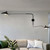 Side profile of adjustable wall sconce showing extended reach and balanced lighting coverage.