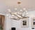 The realistic contemporary tree branch chandelier with glass bubble shades is a stunning fusion of nature-inspired aesthetics and modern design. Crafted with meticulous attention to detail, the lifelike branches showcase a sleek and streamlined form. The glass bubble shades, elegantly suspended from the branches, add a touch of sophistication and create a captivating interplay of light and shadow. This combination of organic elements and contemporary accents brings a unique and enchanting ambiance to any space, making it a true statement piece of modern elegance.