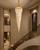 Clarissa Grand Staircase Crystal Chandelier – 300cm Luxury Hotel Stairwell Lighting
A dramatic staircase installation featuring the Clarissa clear crystal chandelier suspended through a tall hotel stairwell. Its 300cm vertical drop and slender 80cm diameter make it particularly suited to grand staircases, multi-level foyers and double-height hospitality spaces where proportion and height are essential.