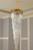 Giovani Luxurious Long Staircase Chandelier in Gold with Clear Crystals - Perfect for Hotel Lobbies, Ballrooms, and Event Spaces