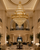 Liliana Large Grand Hotel Gold Crystal Chandelier in Luxury Hotel Lobby
A breathtaking luxury hotel lobby interior showcasing the Liliana Large Grand Hotel Gold Crystal Chandelier suspended dramatically within a double-height reception space. The grand scale, ornate gold detailing and cascading crystal tiers create a powerful focal point, perfectly suited to prestigious hospitality interiors.
